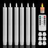 A set of white flameless LED taper candles with a remote timer displayed vertically.