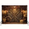 A rustic wooden backdrop featuring a weathered barn door design with cross bracing and decorative lighting for party decorati