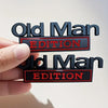 Two black and red emblems for car door decoration featuring the text Old Man Edition