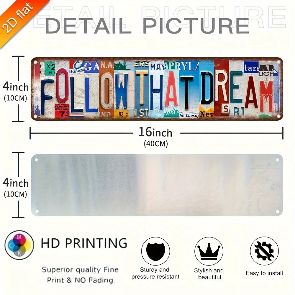 A detail picture of a vintage aluminum metal wall art sign with the text FOLLOW THAT DREAM.