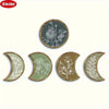 Set of five natural wood moon phase wall decor pieces featuring botanical engravings and muted green tones