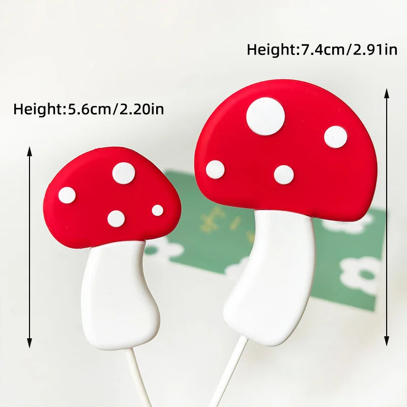 A set of red and white mushroom cake toppers with white stems on wooden sticks.