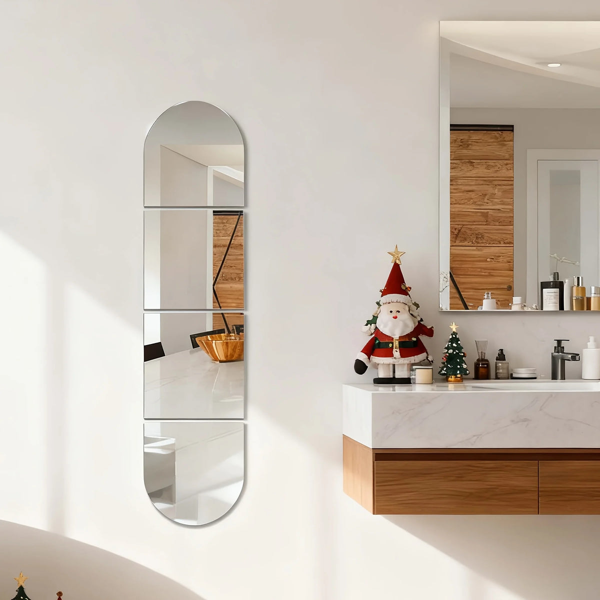 A bathroom vanity featuring a rectangular mirror above a wooden cabinet and marble countertop.