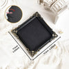 A black vintage baroque resin hanging photo frame displayed on white fabric.