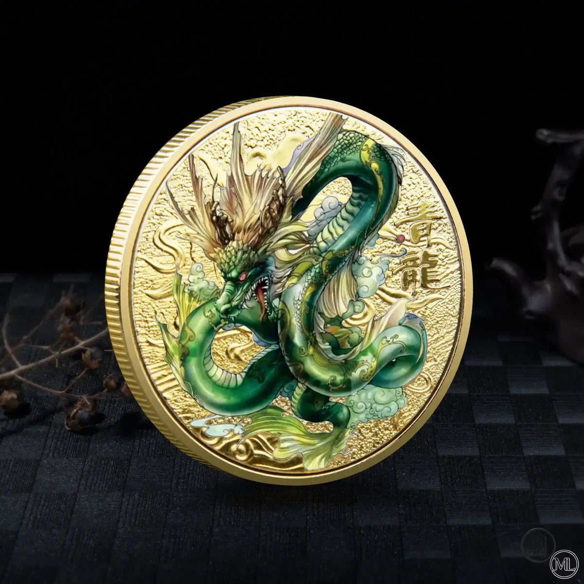 A gold-colored collectible coin featuring a detailed green dragon with a Tai Chi motif against a dark background.