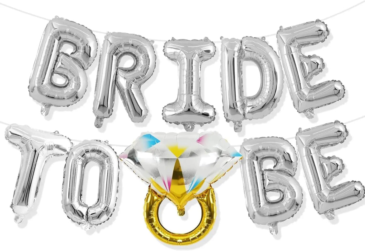 A silver balloon garland spelling BRIDE TO BE, featuring a gold ring accent.