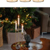 A set of three elegant gold metal candle holders displayed in various angles.