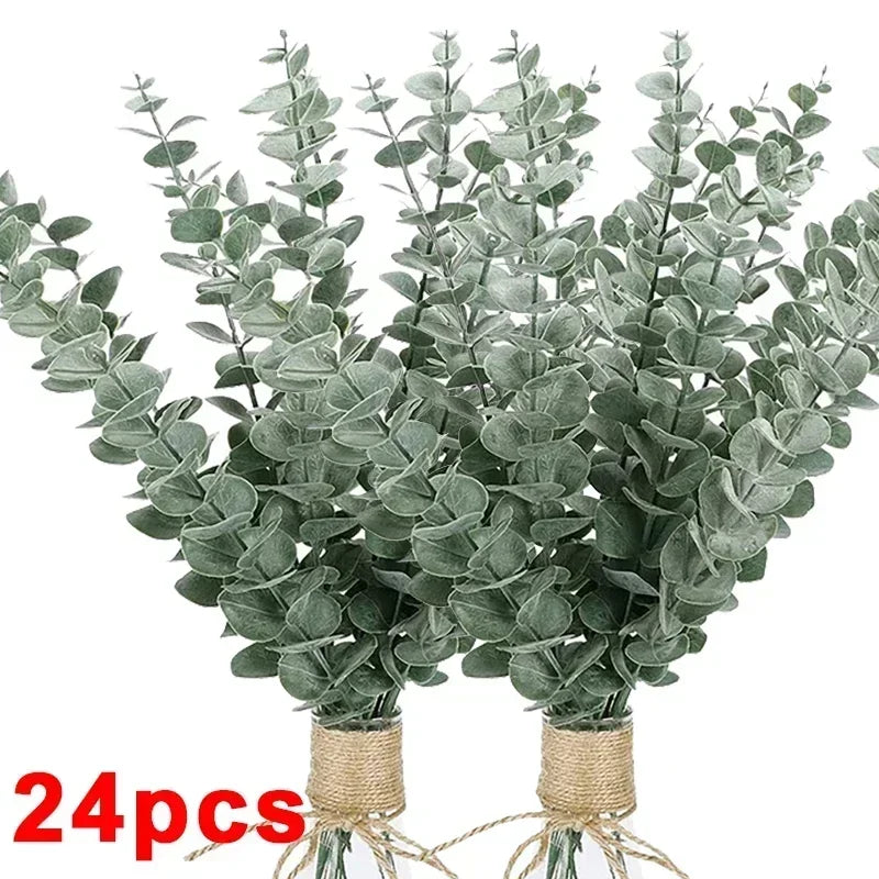 A bundle of artificial eucalyptus stems with realistic green leaves used for home decor and wedding centerpieces.