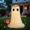 An adjustable glowing ghost Halloween treat bucket draped in sheer white fabric on a green lawn.