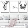 Three black and white line art prints featuring hands holding and the word love on a white background