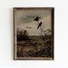 A framed vintage canvas print depicting a dark, moody landscape with silhouetted birds and bare trees.