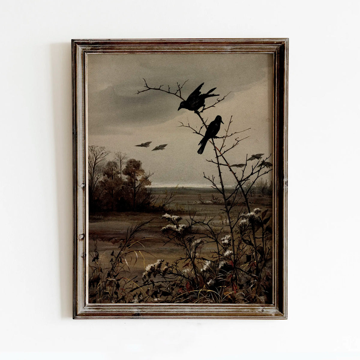 A framed vintage canvas print depicting a dark, moody landscape with silhouetted birds and bare trees.