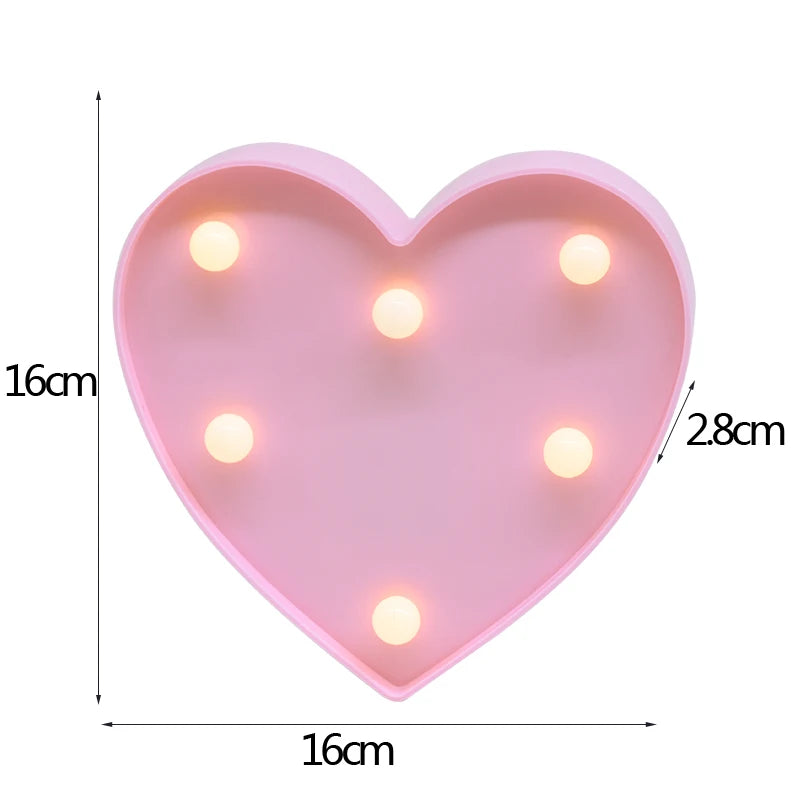 A pink heart-shaped LED light featuring multiple warm white alphabet letters.
