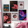 A collection of framed wall art featuring album covers and artwork related to TV Girl and Mitski