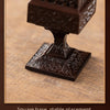 A dark brown Chinoiserie square pixiu incense burner with a square base, shown in a close-up view.