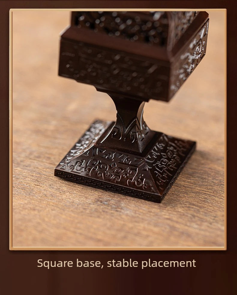 A dark brown Chinoiserie square pixiu incense burner with a square base, shown in a close-up view.