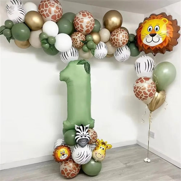 A balloon arch kit featuring sage green number balloons and various animal-themed balloons for a safari jungle birthday decor