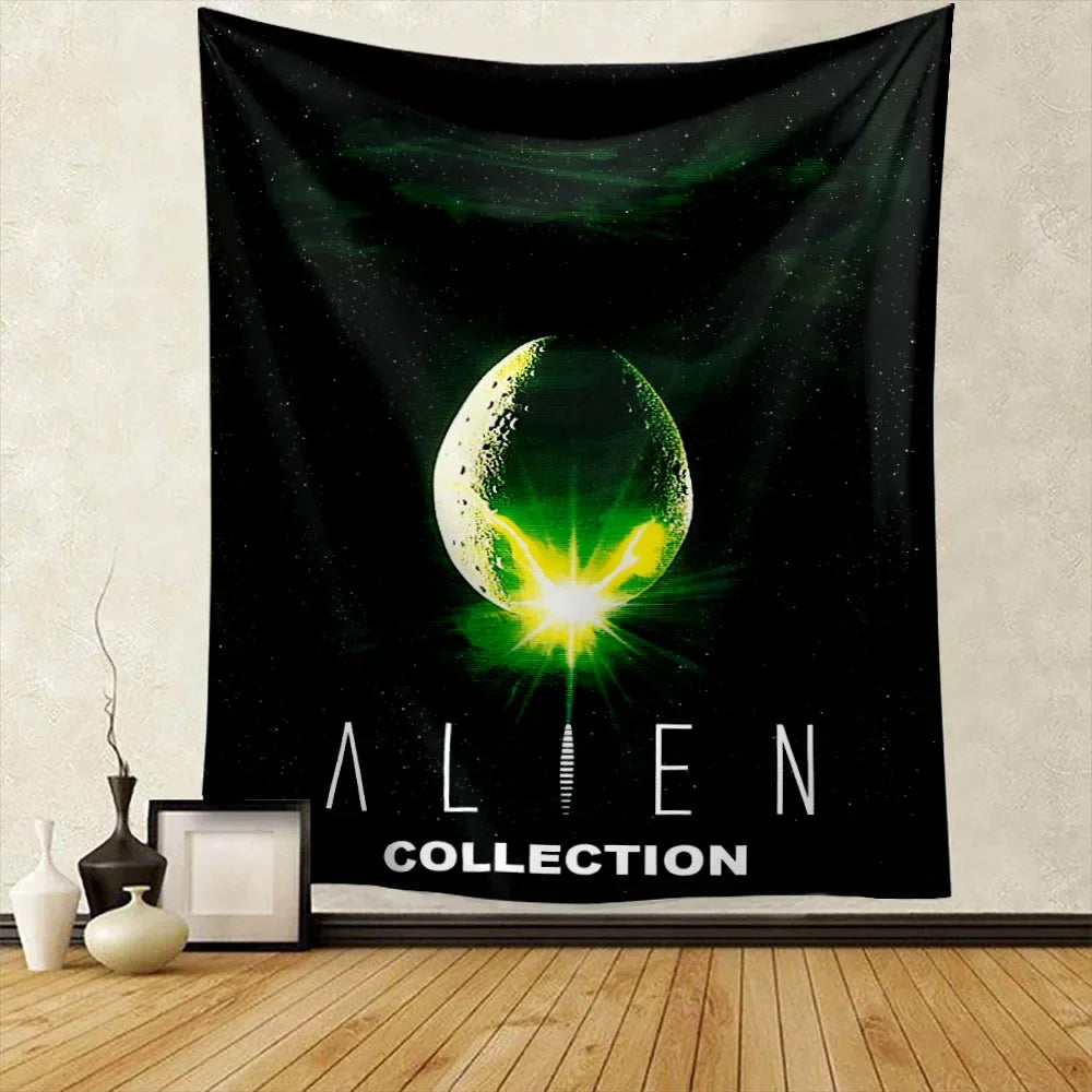 A black tapestry wall hanging featuring a glowing green alien head design with stars and the text ALIEN COLLECTION