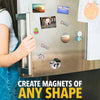A hand is placing various shaped magnets onto a silver refrigerator, demonstrating how to create magnets of any shape.