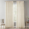 Cream natural linen sheer curtains with rod pocket hanging in a bright room.