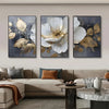 A set of three modern abstract floral wall art prints featuring white and gold flowers on a dark background.