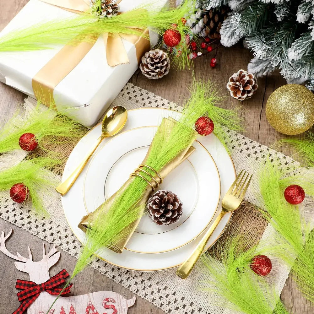 Gold and green Christmas tree decor picks with pinecones and red berries arranged on a rustic wooden surface.