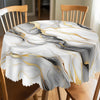 A round tablecloth featuring marble-printed patterns in black, gray, and gold ink textures.