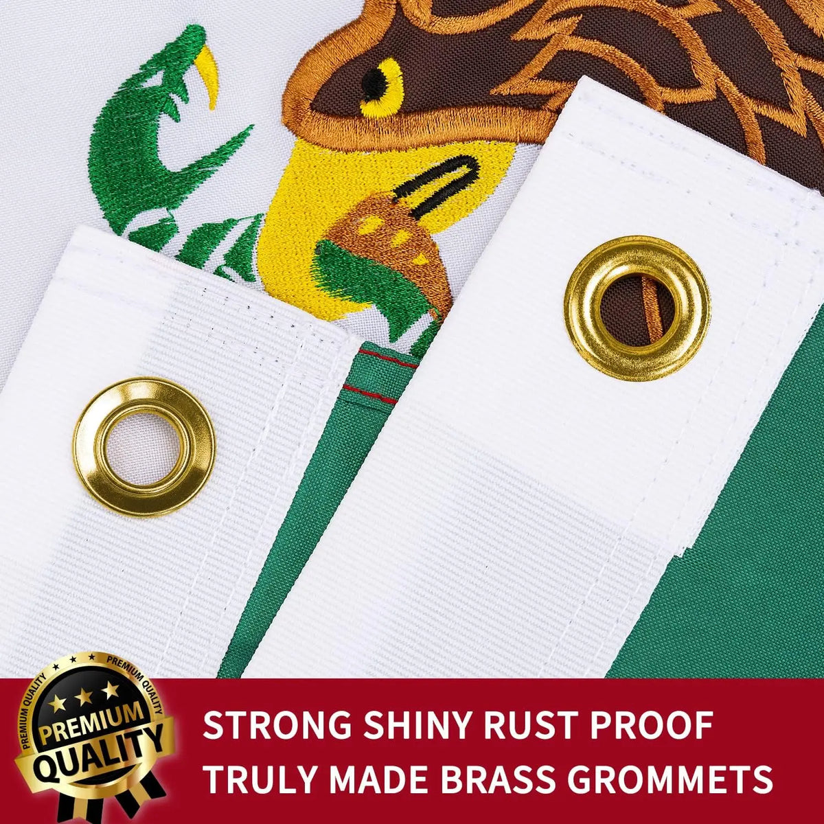 Close-up of white brass grommets and a green embroidered tapestry banner featuring a stylized jaguar head.