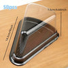 A clear disposable plastic cake slice container with a textured silicone insert resting on a wooden surface.