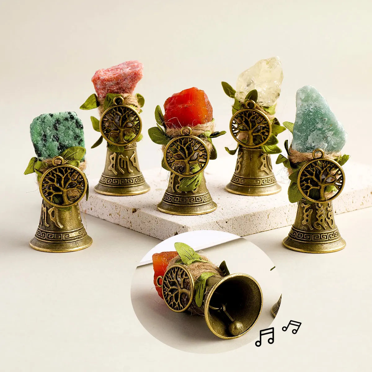 A collection of natural crystals mounted on brass bells with a copper finish.