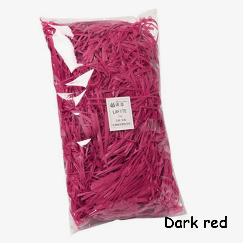Bag of dark red crinkle paper shreds for gift boxes and party decor