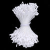 A bundle of white mini artificial flower stamens or pistils used for DIY decoration.
