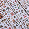 Eine Sammlung festlicher Weihnachtssticker mit Motiven wie Santa, Rentieren, Dekorationen und Winterlandschaften