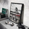 A framed poster of the Vinland Saga anime featuring a character, displayed on a shelf.