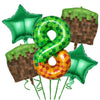 A set of green miner theme party decorations including balloons shaped like numbers and a brown miner-themed table mat.