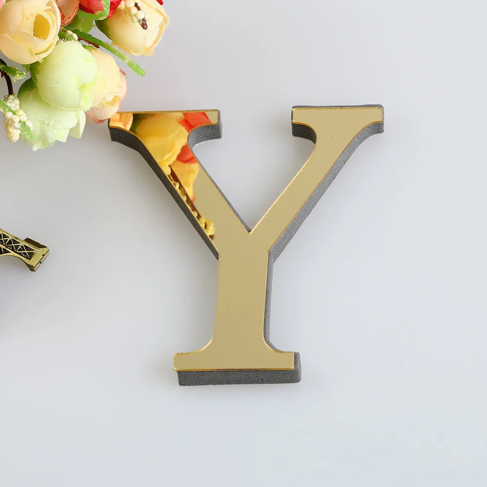 A 3D golden letter Y cutout against a white background with floral elements.