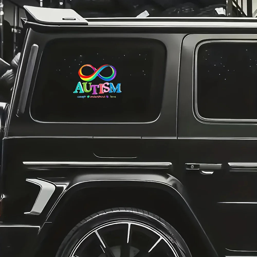 A close-up view of a black SUV with an automotive vinyl decal featuring the Autism awareness ribbon and the word AUTISM.