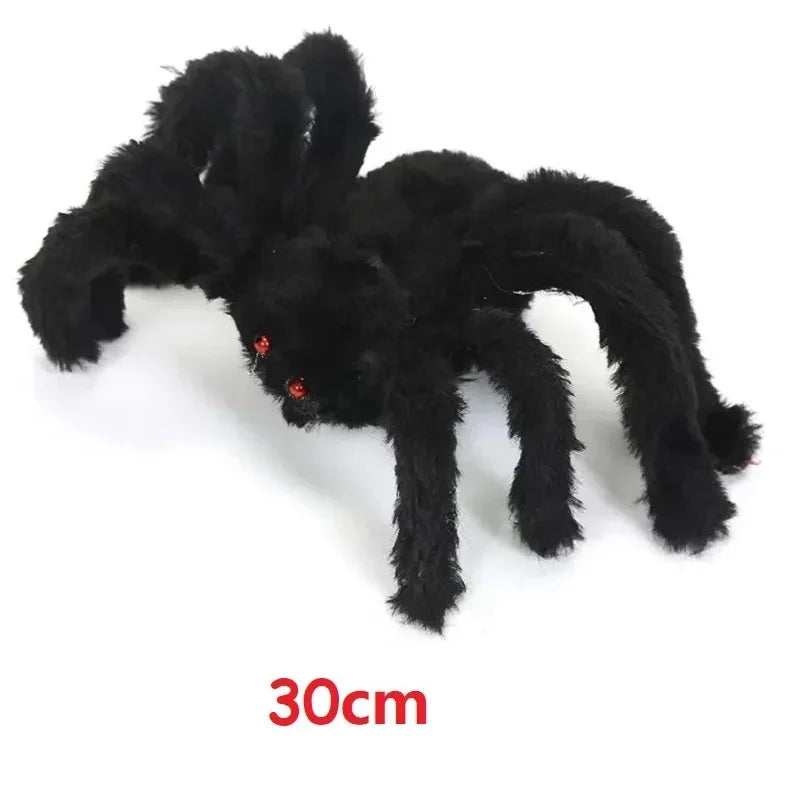 A black plush spider decoration, approximately 30cm long, used for Halloween.