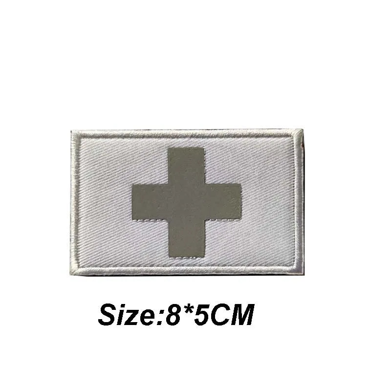 Silver medical cross tactical morale patch with a white background