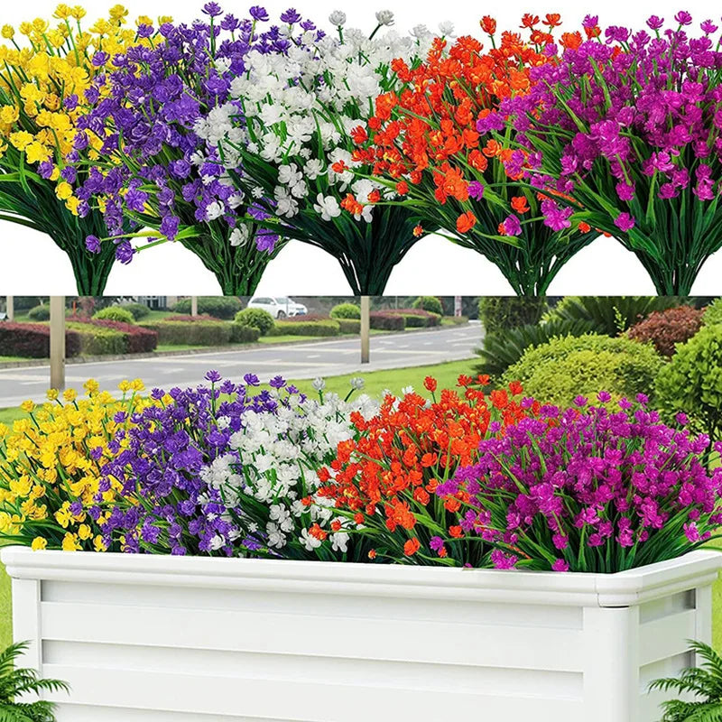 A bundle of vibrant artificial flowers in yellow, purple, white, orange, and pink arranged in a white planter box.