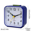 A blue digital alarm clock with a white face showing the time, featuring a night light and snooze function.