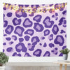 A purple leopard print tapestry wall hanging decorated with warm string lights.