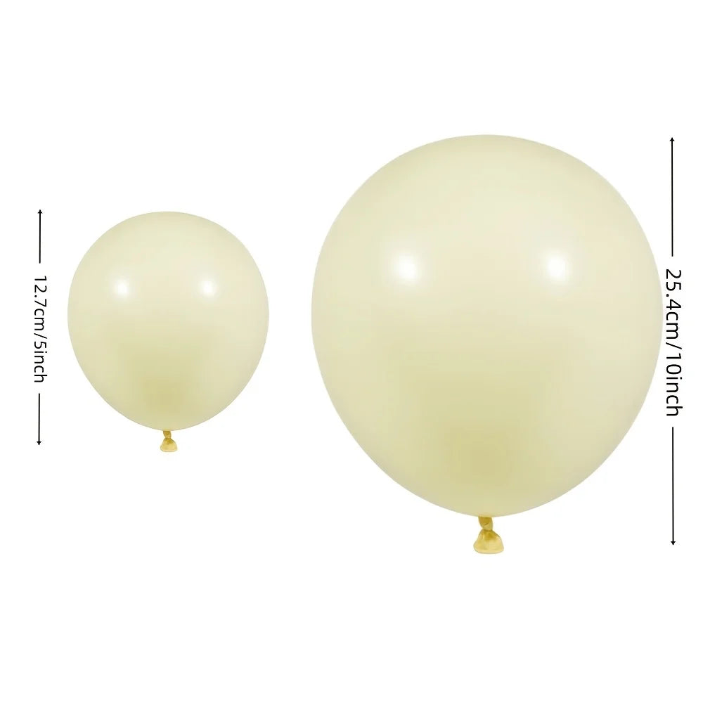 A single pale yellow latex balloon with a gold-colored knot, shown next to a measurement guide.