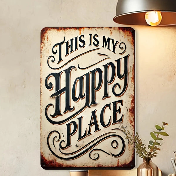A rustic iron wall sign with carved text that reads This Is My Happy Place, mounted on a light-colored wall.