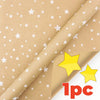 A roll of festive snowflake Christmas wrapping paper in a light brown color.