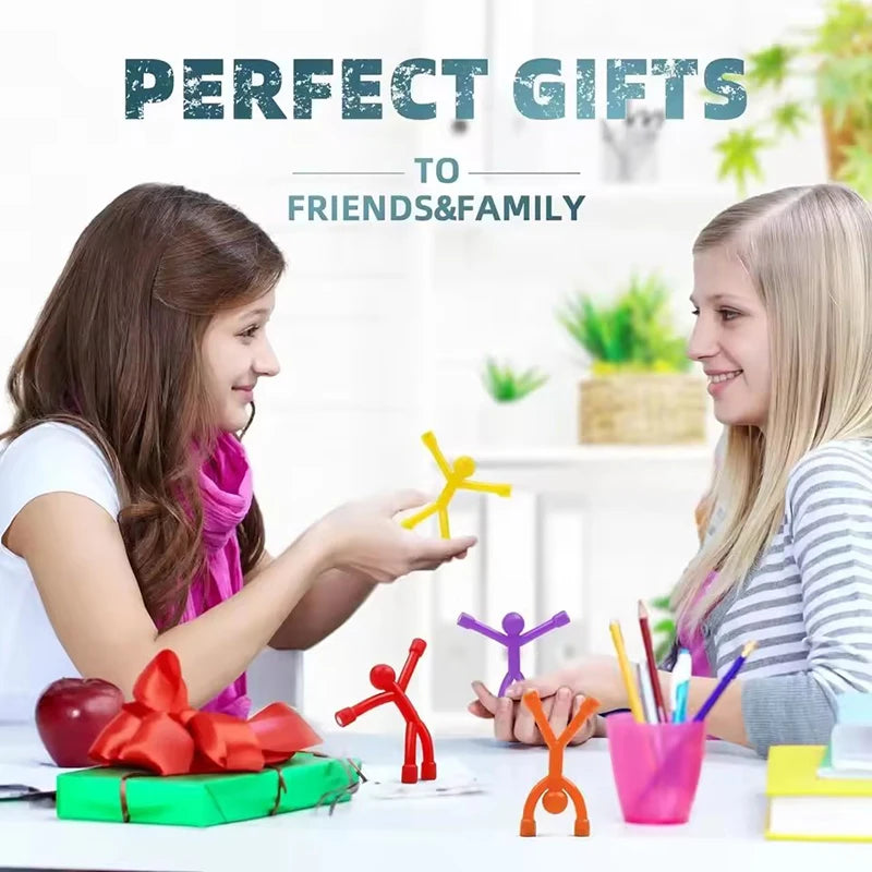 A young woman is presenting colorful fridge magnets to another young woman in a bright indoor setting.