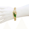 Gold Cuban link bracelet featuring a green enamel figure of St. Jude.