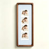 A wooden photo strip frame displaying five portrait photos of a couple.