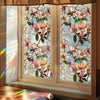 Botanical print static cling window film featuring pink and white flowers in a window frame.