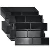 A collection of black peel and stick vinyl wall tile decor pieces arranged in rows.